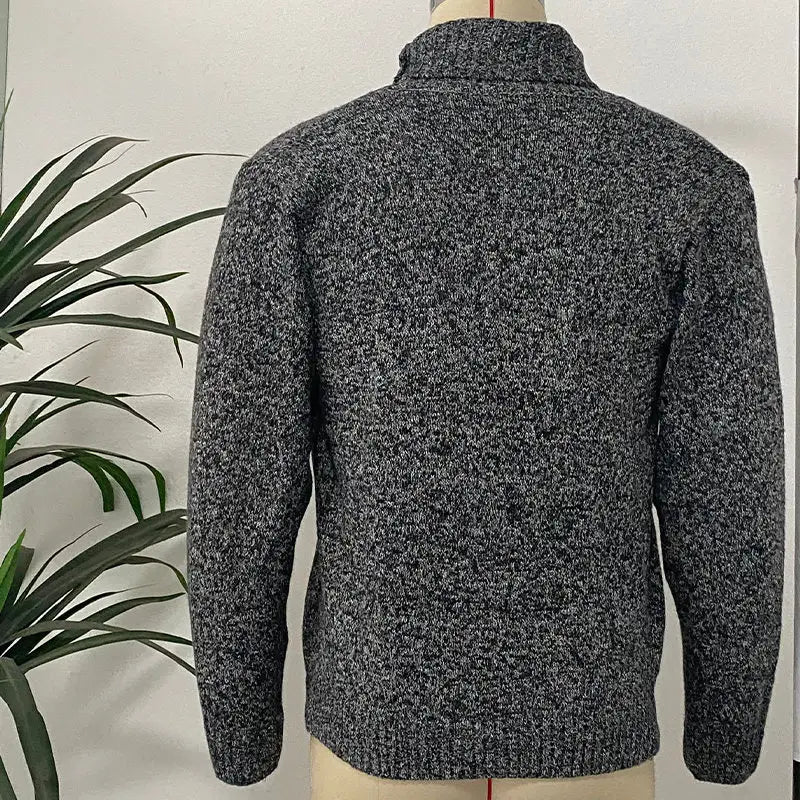 men’s double-breasted knit cardigan in textured charcoal gray with a high collar and ribbed cuffs made from knit material.