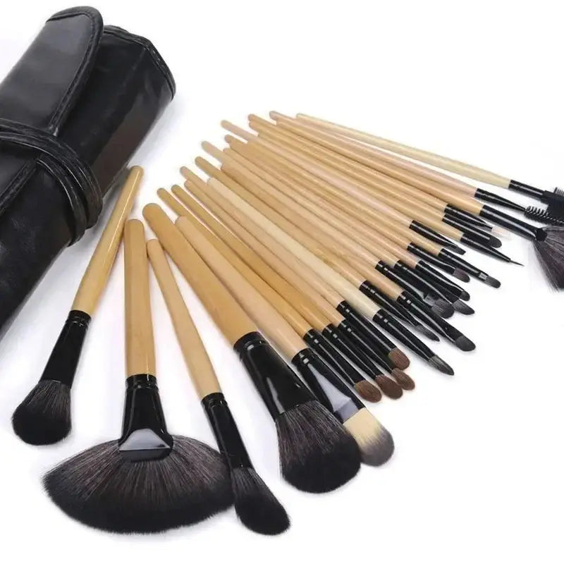 Set of 25 professional makeup brushes with natural wood handles black ferrules and soft synthetic bristles in various shapes and sizes.