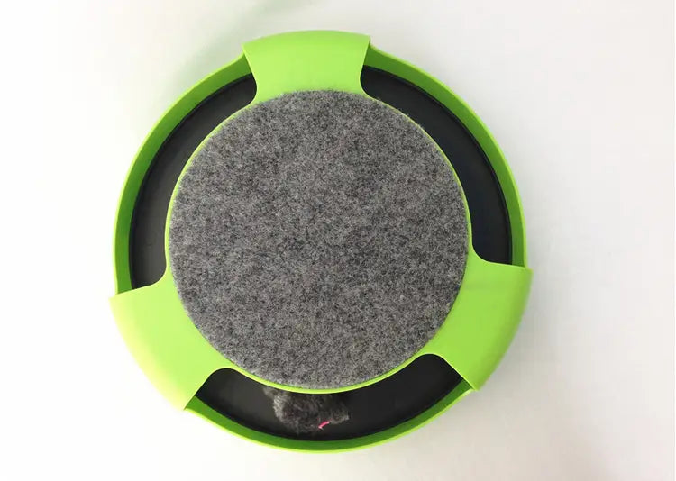 Tobogán/rueda giratoria interactiva para gato de color verde brillante, con un centro de fieltro gris y un anillo interior negro, diseñado para un juego estimulante.