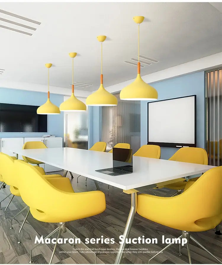 yellow conical nordic macaron led pendant lamps with wood and orange accents hang from the ceiling.