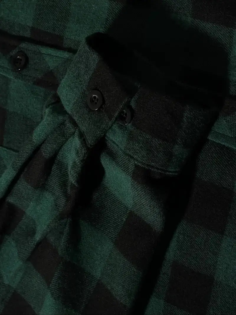 Men’s plaid hooded flannel shirt in dark green and black with buttoned cuffs made of soft flannel material.