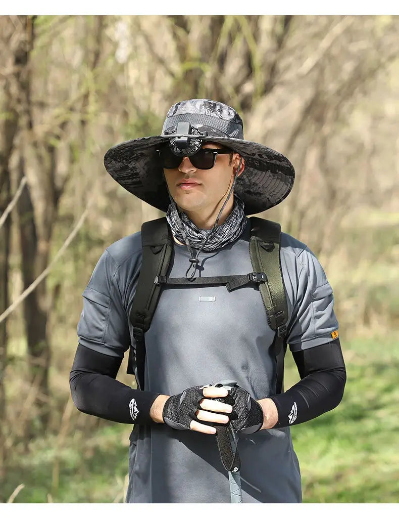 Gray camouflage wide-brimmed men sun hat with adjustable strap and front buckle designed for hiking and camera mounting.