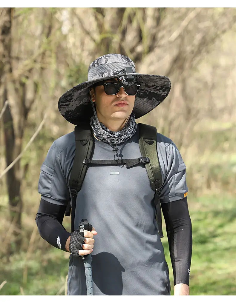 Gray camouflage bucket hat with wide brim and adjustable strap designed for men sun hat camera mount wide brim hiking use.