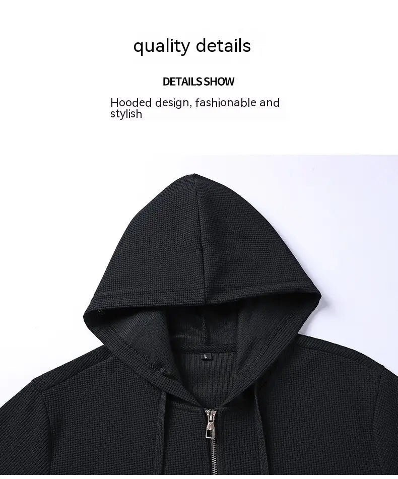 Black textured hooded zip-up jacket with a sleek modern design from the waffle hooded sportswear set.