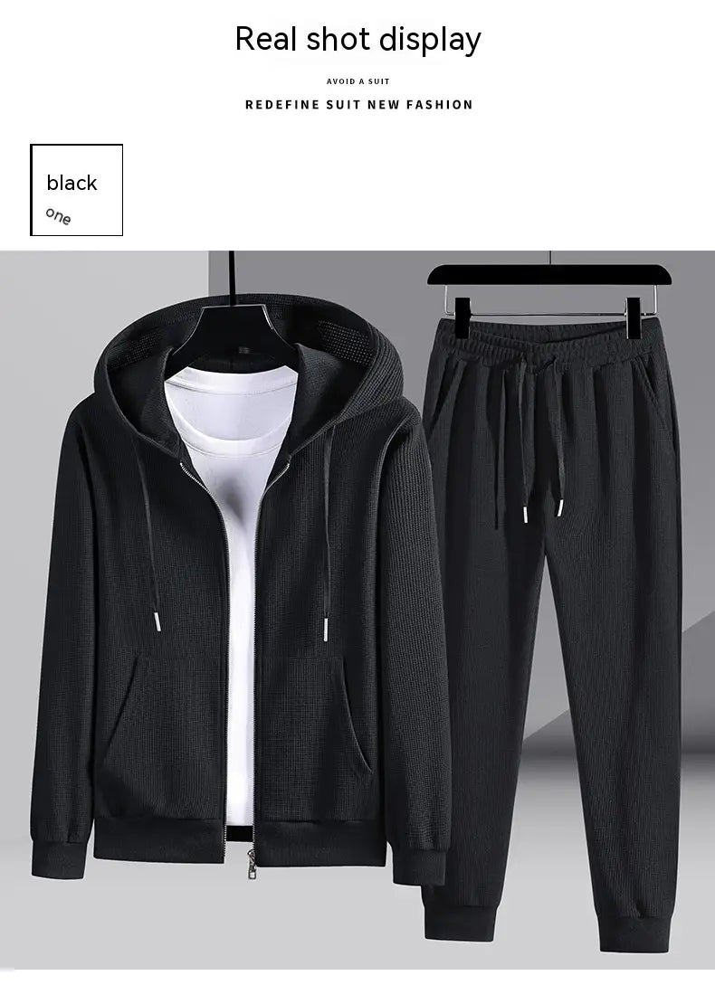 black ribbed knit hooded zip-up jacket with drawstring and front pockets from waffle hooded sportswear set designed for casual and athletic wear