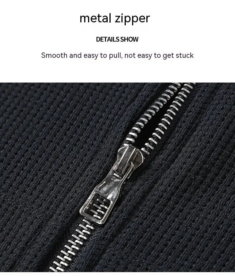 silver metal zipper with sleek functional design on dark textured fabric of waffle hooded sportswear set