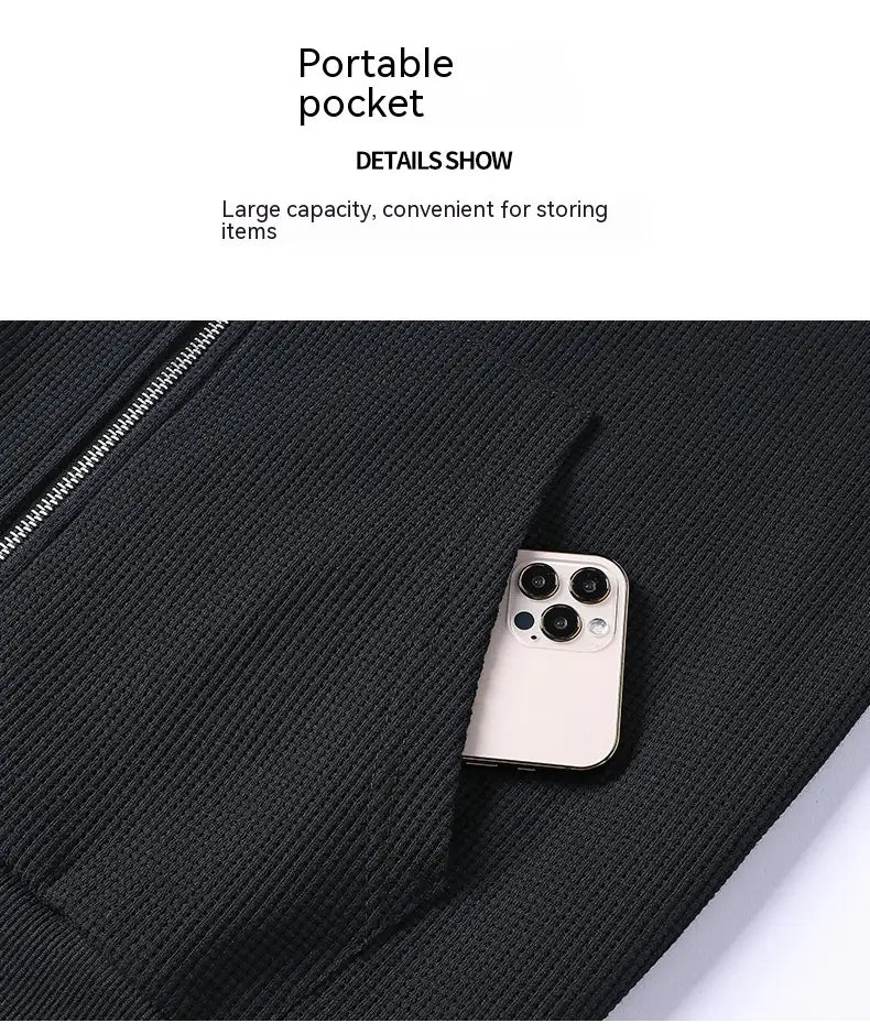 black ribbed fabric pocket with silver zipper on waffle hooded sportswear set designed for convenient storage