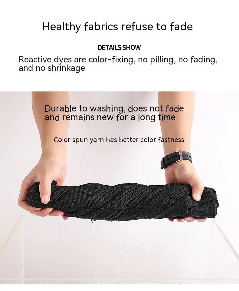 black tightly twisted fabric roll of the waffle hooded sportswear set made from durable fade-resistant material with reactive dye for long-lasting color.