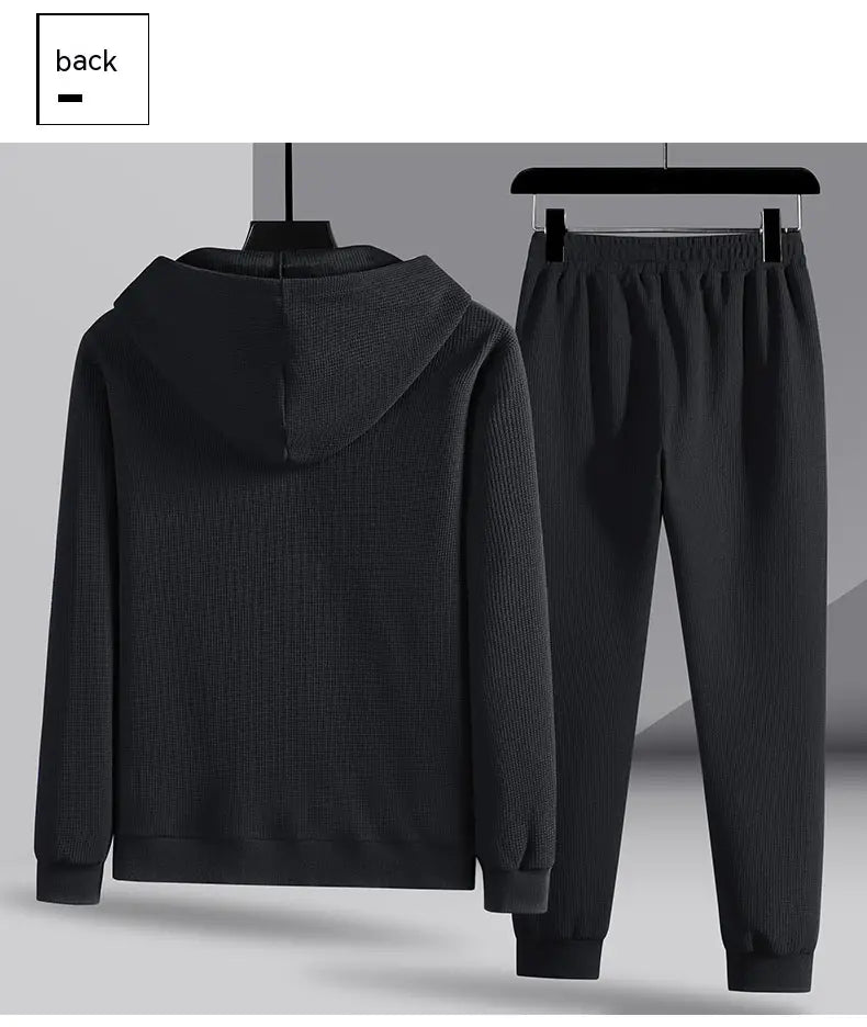 black ribbed knit hooded sweatshirt and matching jogger pants set in waffle sportswear material designed for casual and athletic wear