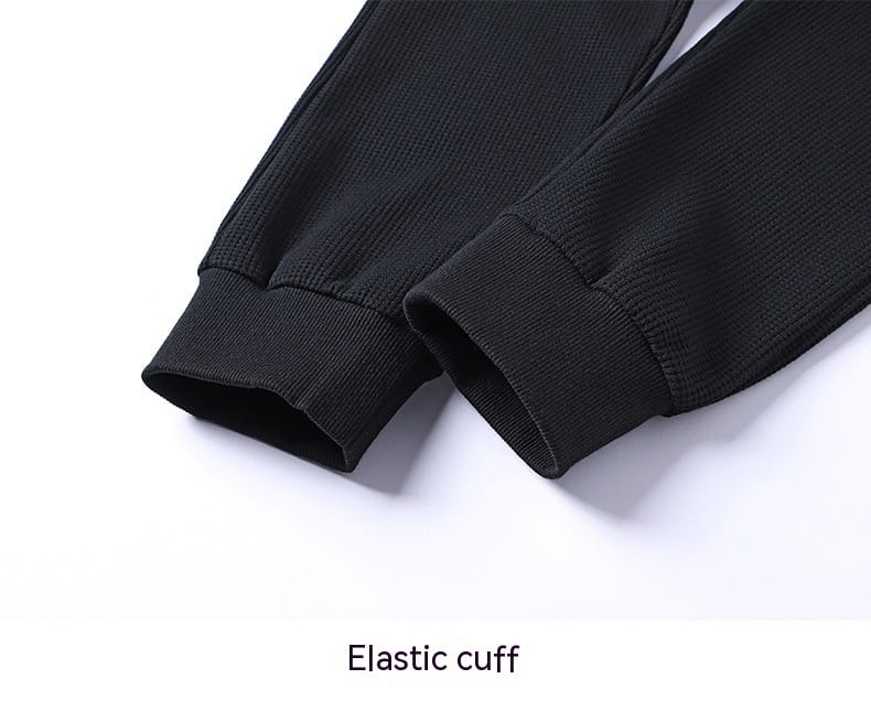 black elastic cuffs with ribbed texture on waffle hooded sportswear set for athletic wear