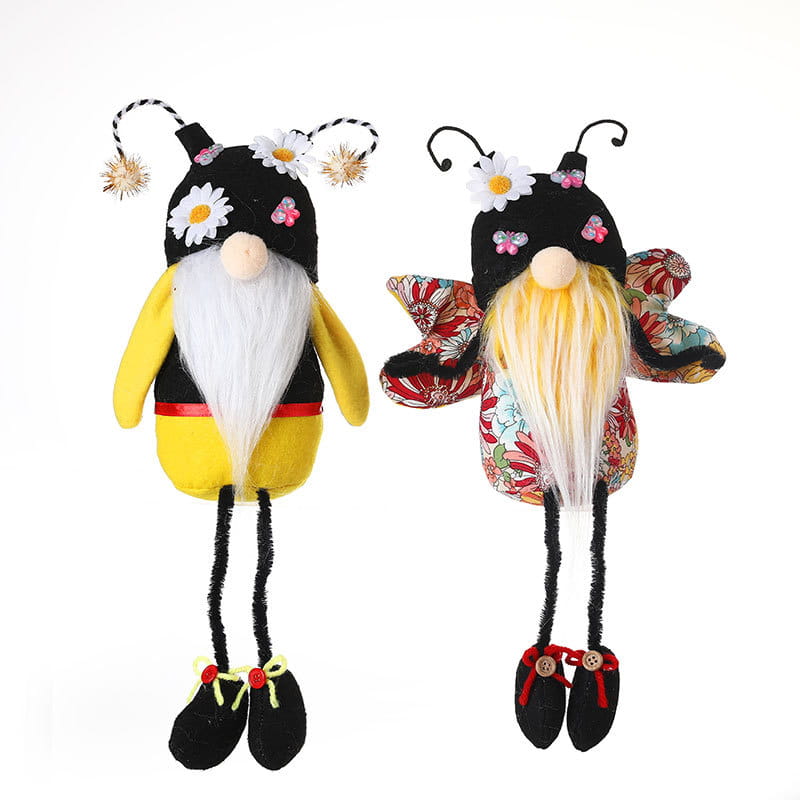 Deux peluches d’gnomes abeille à longues jambes sans visage pour décoration, avec une paire comprenant un gnome noir et jaune avec une barbe blanche et un gnome en tissu à motif floral avec une barbe blonde.