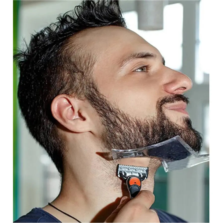 A sleek transparent plastic beard shaping tool and template comb for men with a black and orange handle is being used to trim facial hair.