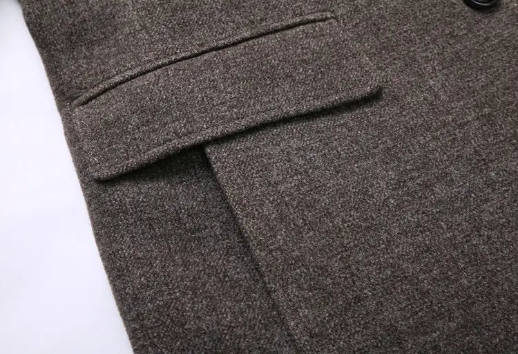 Men wool overcoat plaid lined lapel winter jacket in textured charcoal gray wool with classic flap pocket and dark button detail.