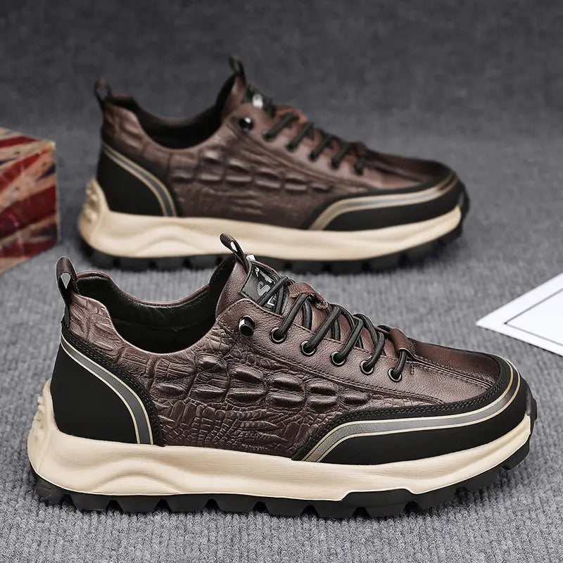 Men’s black crocodile embossed leather sneakers featuring brown crocodile-embossed leather with black and cream accents.