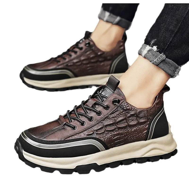 Men’s black crocodile embossed leather sneakers featuring brown crocodile-embossed leather with black and silver accents on a chunky sole.