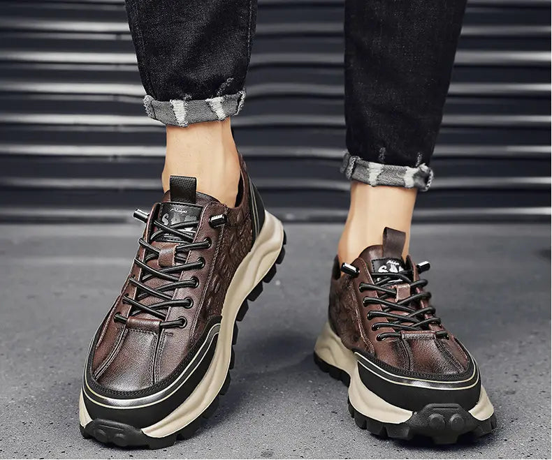 Men’s black crocodile embossed leather sneakers featuring a brown leather textured upper with black laces and accents and a chunky off-white midsole.