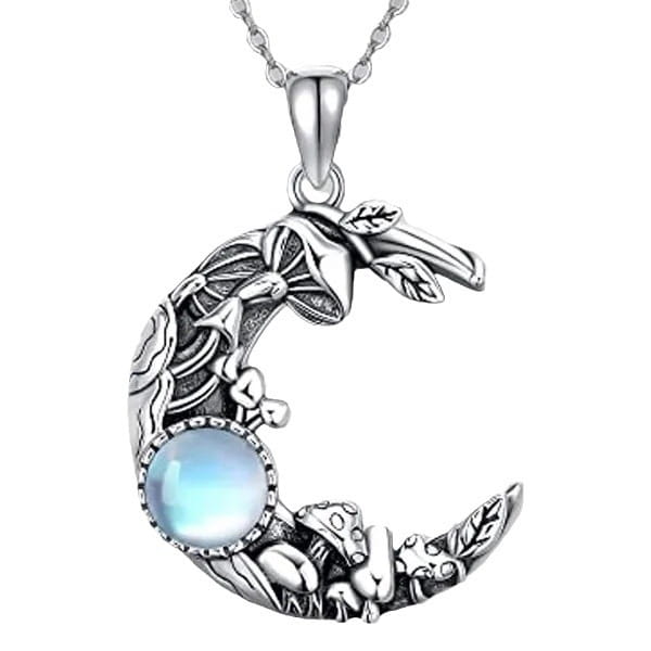 Bohemian silver crescent moon pendant necklace featuring intricate mushroom and leaf designs with a central blue moonstone.