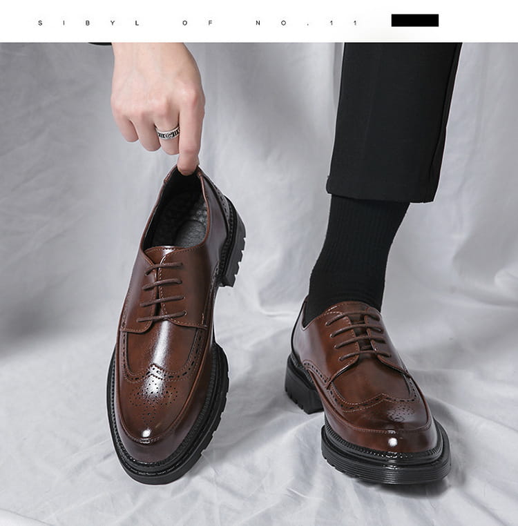 Men’s british style brown leather brogue oxford shoes with glossy finish and chunky black rubber soles.