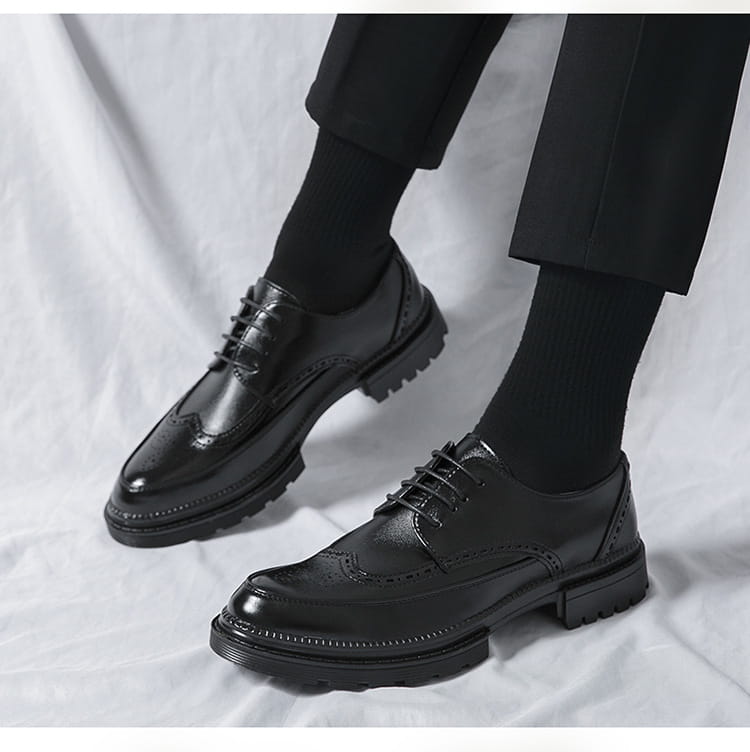 Men’s british style brown leather brogue oxford shoes with glossy finish and chunky black rubber soles.
