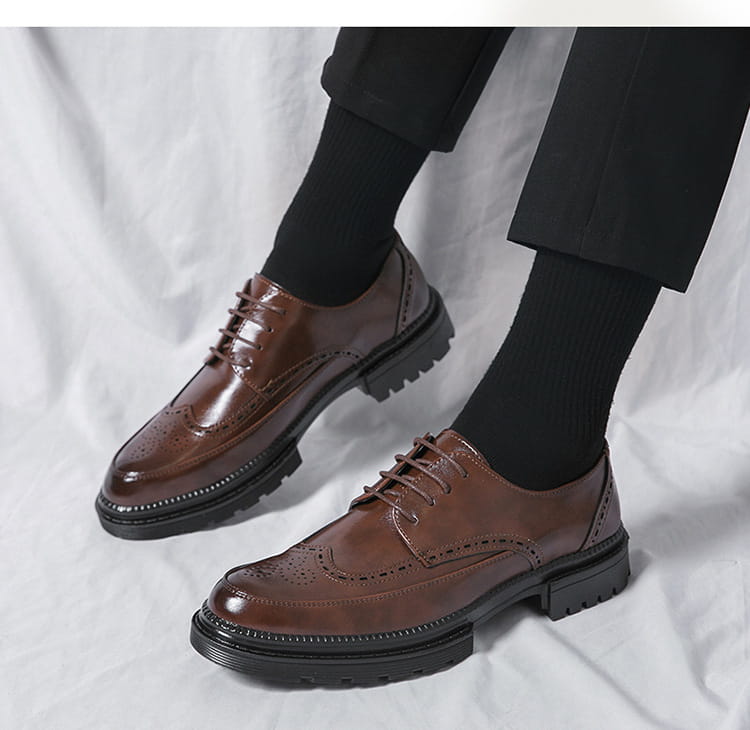 Men’s british style brown leather brogue oxford shoes with glossy finish and chunky black rubber soles.