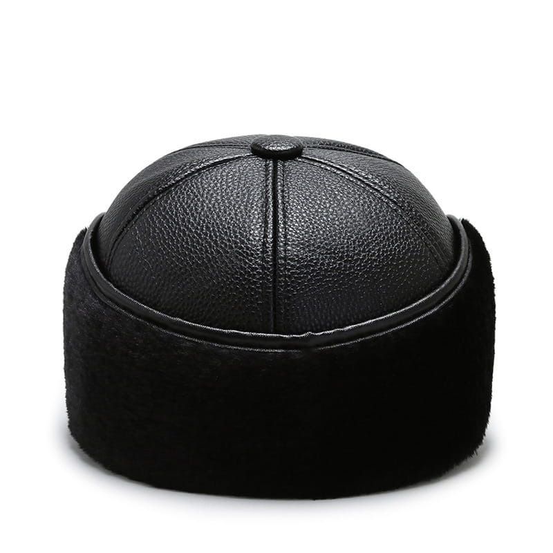 men leather winter baseball cap with ear flaps featuring black leather and fur, textured top, and plush soft lining for cold weather use.