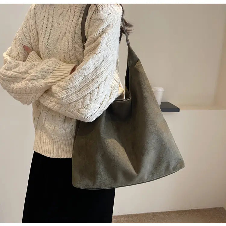 Olive green suede shoulder bag with large capacity and slouchy tote design featuring a simple minimalist style.