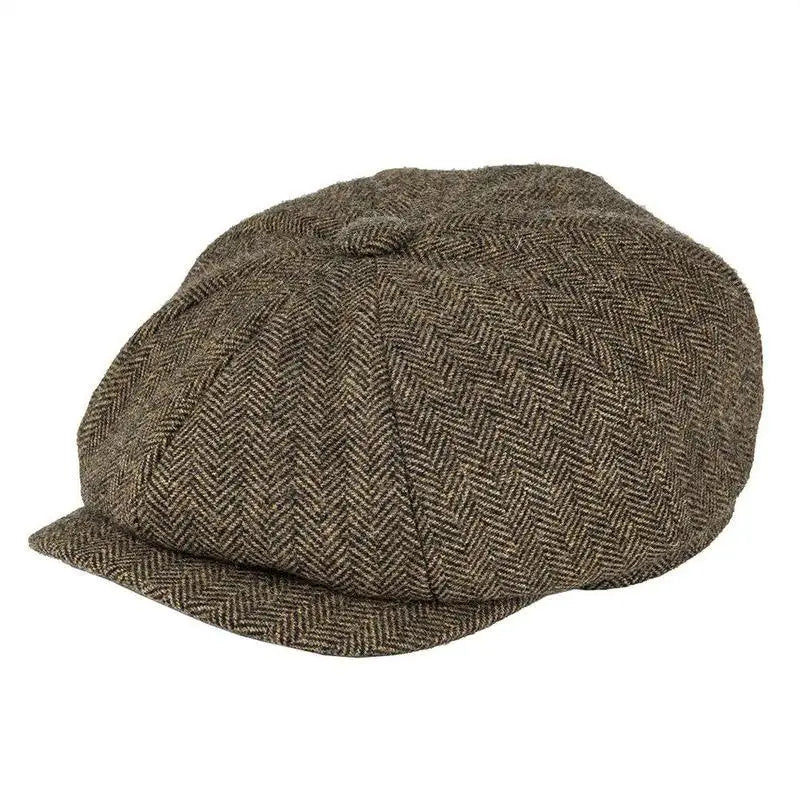 A brown herringbone tweed wool newsboy hat for men featuring a structured eight-panel design and a slightly curved flat cap brim.