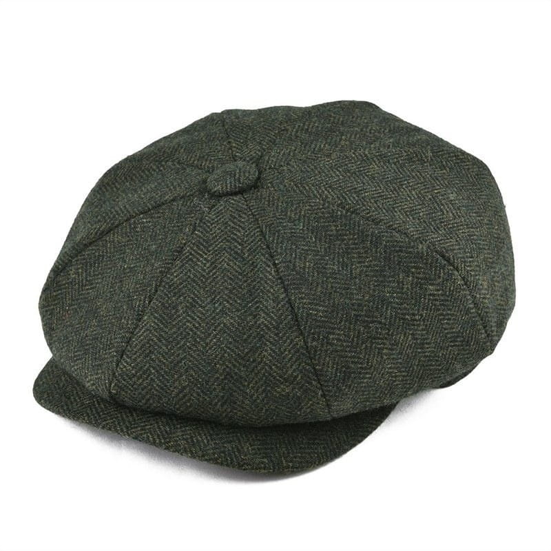 Dark green herringbone tweed wool newsboy hat for men featuring a structured eight-panel flat cap design with a small button at the top.