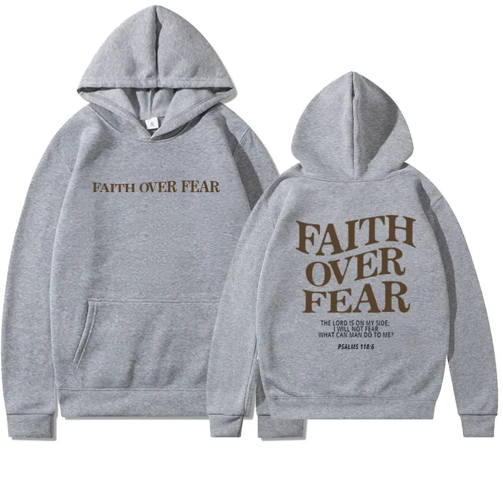 gray hoodie with faith over fear printed in brown on the front and back featuring a kangaroo pocket from the faith over fear psalm 118 6 christian aesthetic hoodie collection