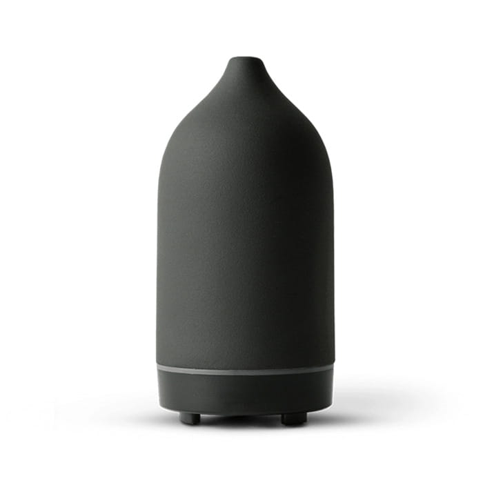 Matte black ceramic ultrasonic aroma diffuser and humidifier with a sleek rounded body and subtle base accent.