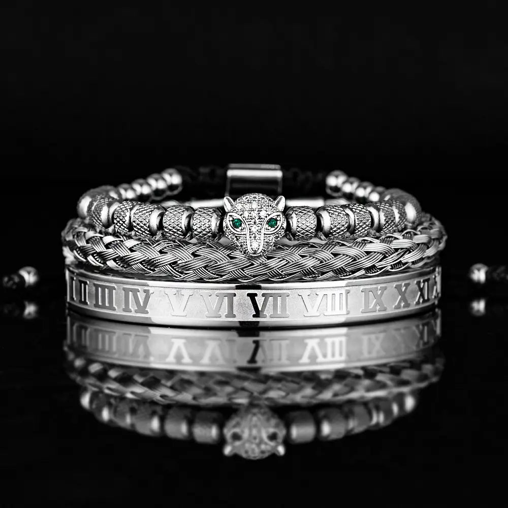 Silver-toned roman numeral leopard head braided leather bracelet set featuring a central leopard head charm with green eyes, textured beads, and an engraved roman numeral band.