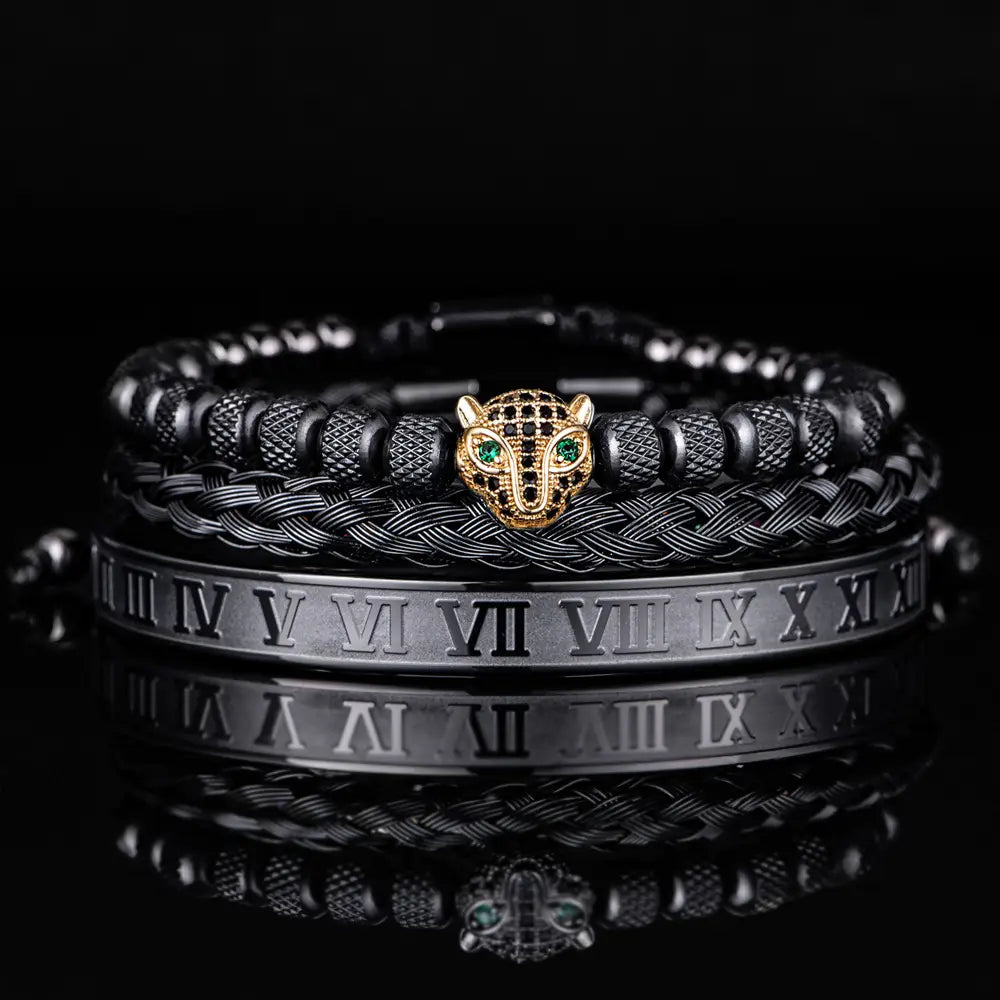 Black braided leather bracelet with a gold-toned panther head charm featuring green gemstone eyes and roman numeral detailing from the Roman numeral leopard head braided leather bracelet set.