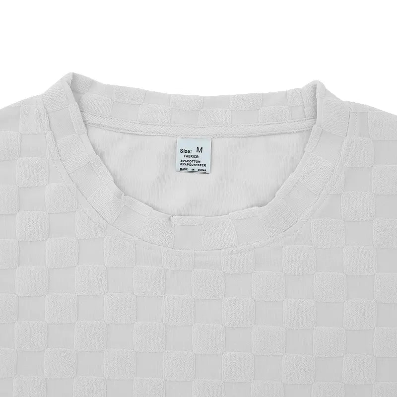 White woven-textured cotton blend t-shirt with a subtle checkered pattern from the textured geometric t-shirt and shorts set.