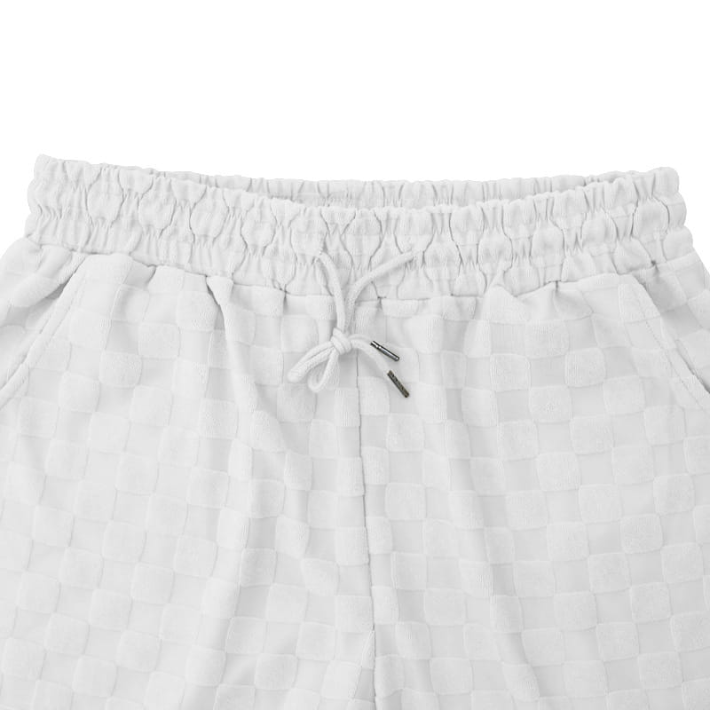 white checkered cotton joggers with an elastic waistband and matching drawstring from the textured geometric cotton blend t-shirt and shorts set