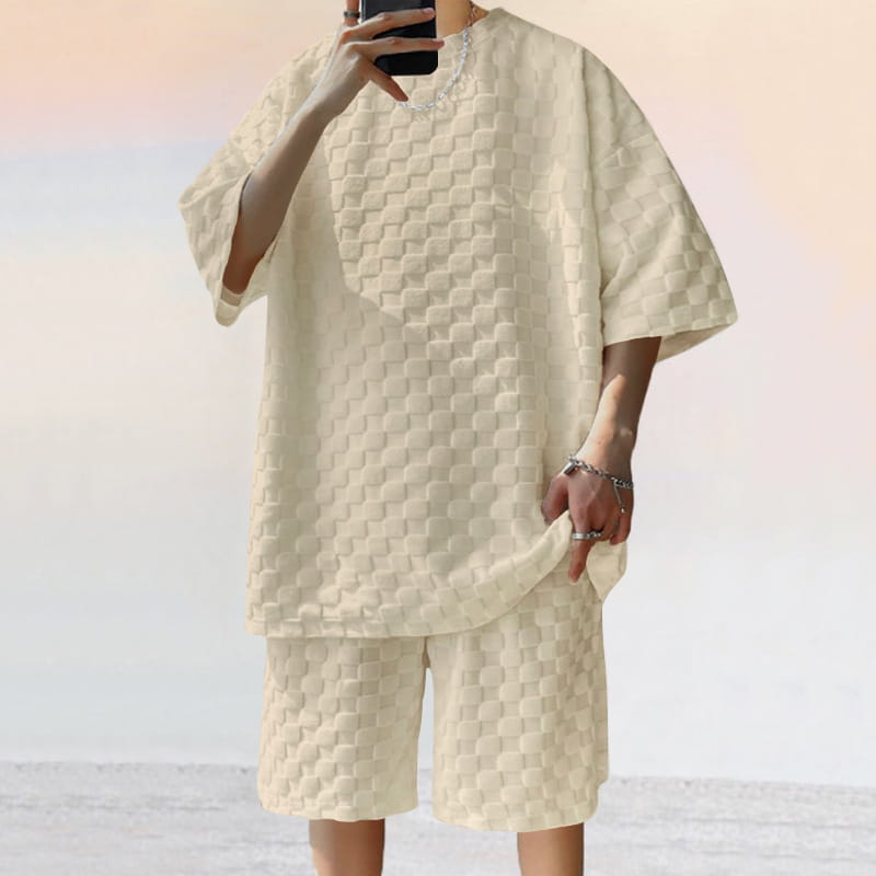 Cream-colored textured short-sleeved cotton blend t-shirt and shorts set with a quilted geometric pattern.