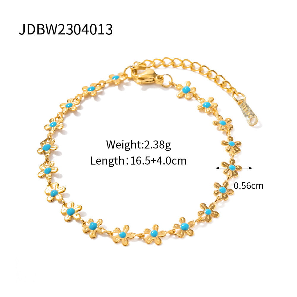 Gold-toned floral anklet with turquoise center stones and a delicate chain clasp from the turquoise daisy gold chain necklace and bracelet set.