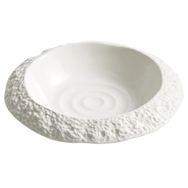 White ceramic deep plate with a modern rock pattern featuring a rough textured exterior and smooth interior with concentric circular ridges.