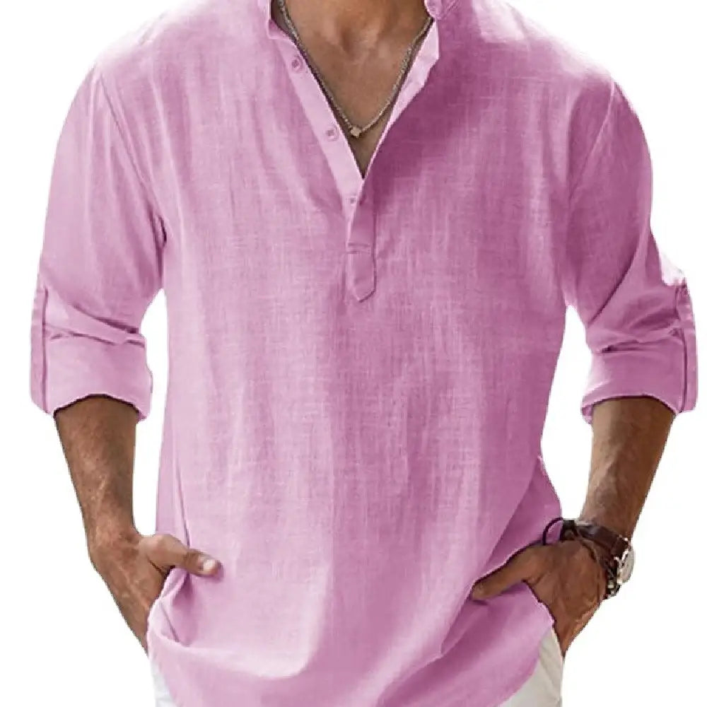 A light pink loose linen blend breathable long sleeve sports shirt with a buttoned placket and rolled cuffs.