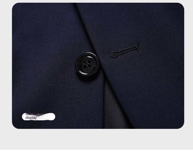 Black four-hole button on a navy blue men’s slim fit casual blazer suit jacket displayed in close-up.