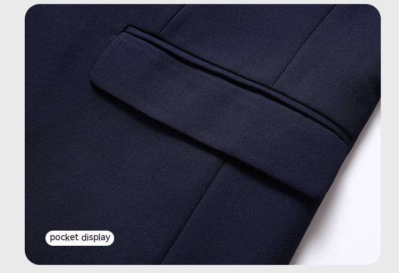Men’s slim fit casual blazer suit jacket in dark navy with a pocket featuring neat stitching and a subtle textured fabric finish.