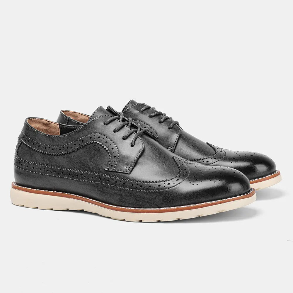 Men’s brogue casual leather sneakers in black with perforated detailing and a contrasting tan sole designed for lightweight comfort.