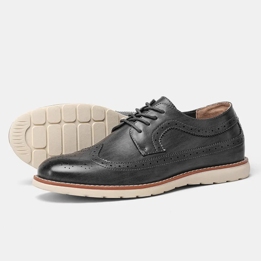 Men’s brogue casual leather sneakers in black with perforated detailing and a contrasting tan sole designed for lightweight comfort.