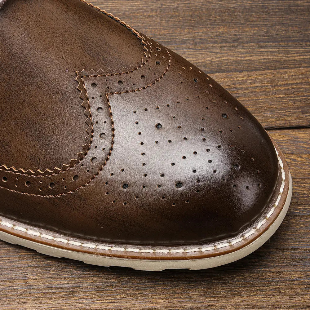 Men’s brogue casual leather sneakers in brown with perforated detailing and white stitching along the sole designed for lightweight comfort.
