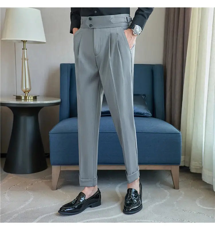 Gray pleated drape casual trousers with a tailored fit and rolled cuffs for men.