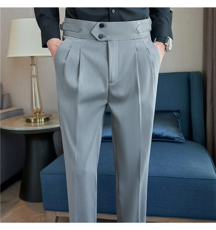 Gray pleated men’s drape casual trousers with a tailored waistband featuring two black buttons and decorative notched flaps.