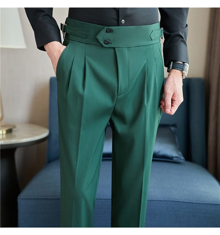 Mens pleated drape casual trousers in emerald green featuring wide belt-like waistband with black buttons and metallic hardware.