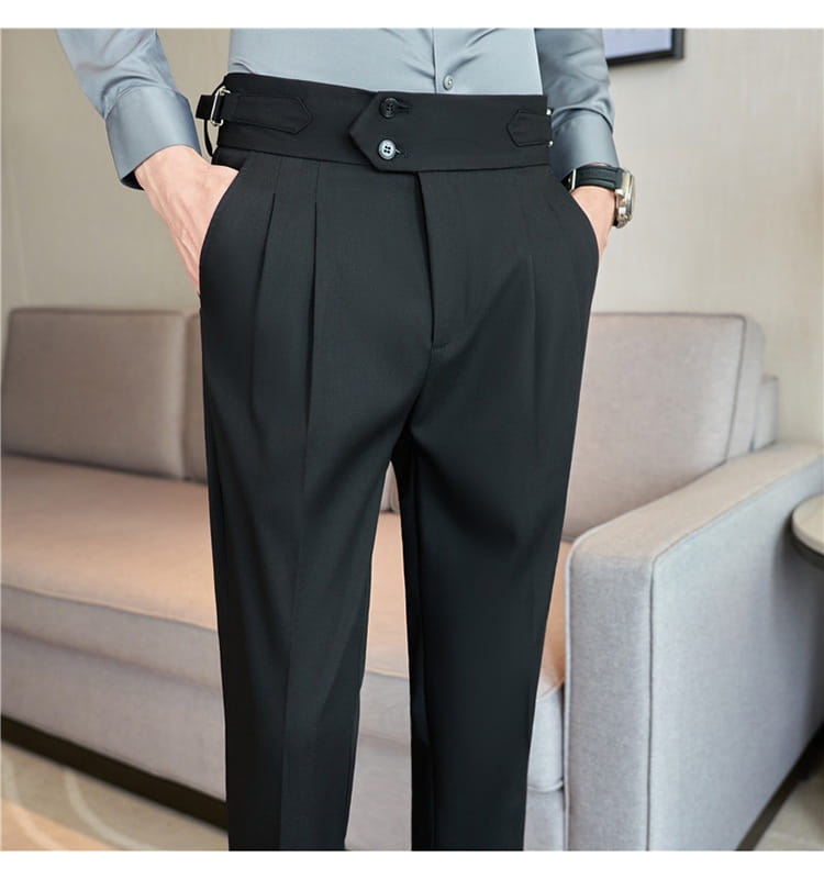 black pleated drape casual trousers featuring a structured waistband with central button closure and belt loops for menswear.