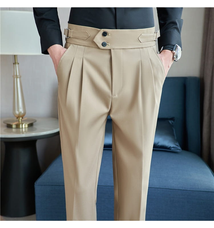 mens pleated drape casual trousers in beige featuring pleated fabric with a wide belt-like waistband with two dark buttons and decorative flaps.