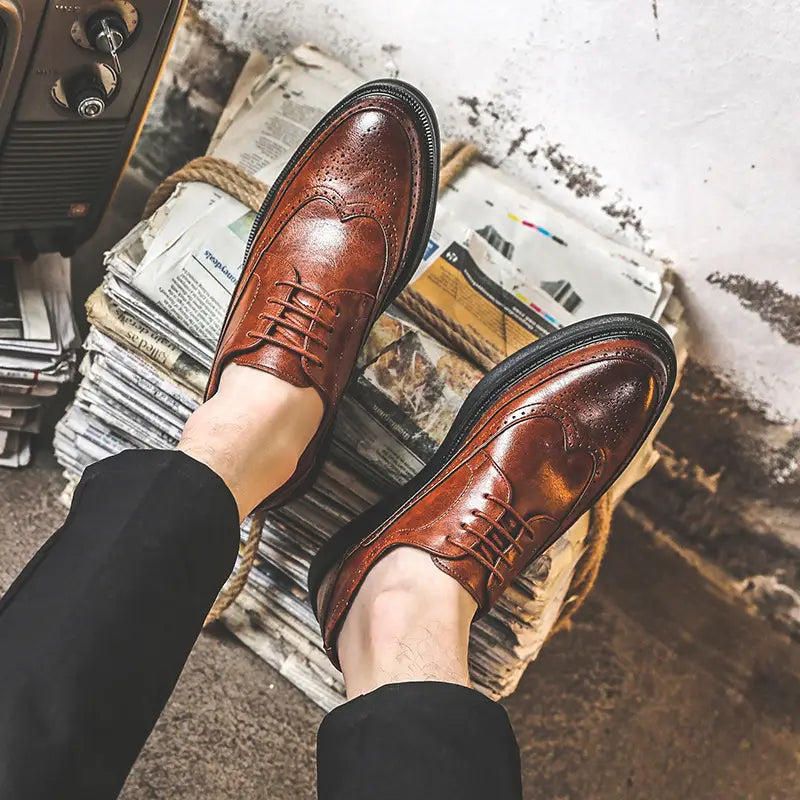 Men’s brogue Oxford shoes in brown leather featuring black chunky soles and detailed perforated patterns for business casual wear.