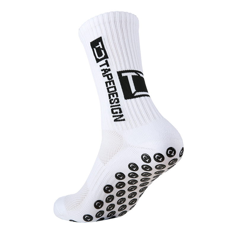 Chaussette de football antidérapante blanche avec logo noir et motifs circulaires texturés sur la semelle pour une meilleure adhérence